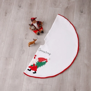 White Christmas tree skirt with red border featuring embroidered Santa Claus and Christmas text
