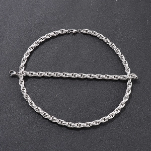 Detailed view of silver stainless steel twisted chain with secure lobster clasps