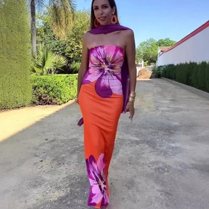 Detail of floral print tube maxi dress in orange and purple for summer vacation
