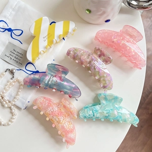 Set of six colorful vintage acetate hair claws in various patterns and marble textures