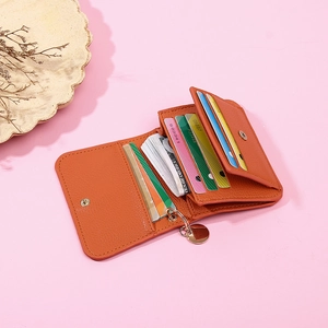Internal layout of orange leather wallet showing multiple card slots and cash compartment