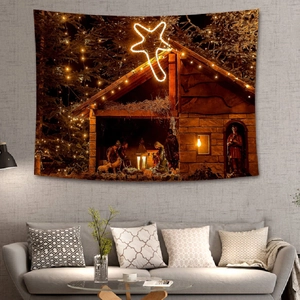Christmas nativity scene wall tapestry hanging over a grey sofa in a modern living room