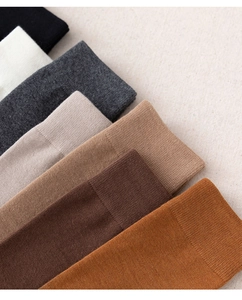 Detailed close-up of ribbed knit cotton calf socks in six assorted earthy colors