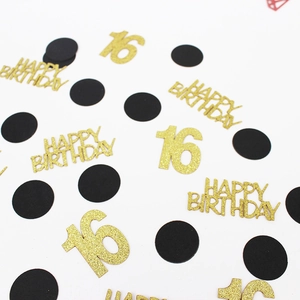 Macro detail of 16th birthday confetti with gold glitter 16 and Happy Birthday text
