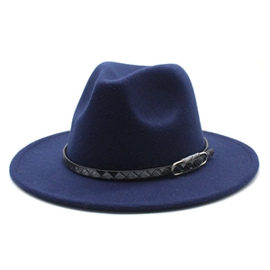 Close-up of navy blue wool fedora hat featuring a black woven leather band and buckle