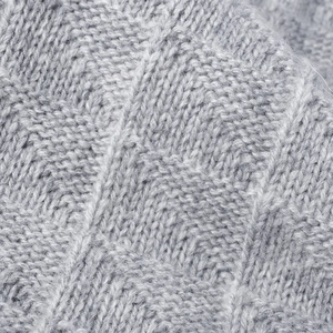 Women's light grey chunky knit beanie with warm wool texture and geometric diamond pattern