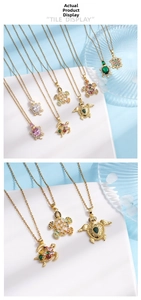 Detail of gold turtle necklaces featuring vibrant zircon gemstones and ocean-style display