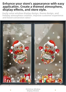 Détail de stickers de Noël avec bonhommes de neige et boîtes cadeaux sur porte vitrée