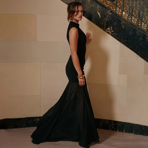 Elegant black sleeveless fishtail maxi dress with sheer tulle hem and slim fit waist