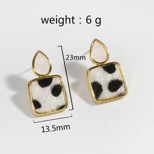 Detail view of leopard print horsehair earrings with dimensions 23mm by 13.5mm