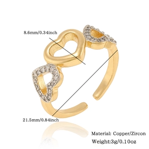 Detail view of adjustable copper ring with three hearts and inlaid zircon stones