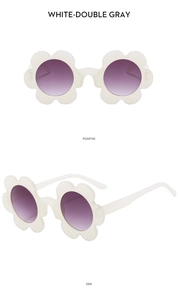 Front and side view of white flower-shaped kids sunglasses with purple gradient lenses