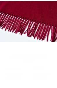 Detail of dark red cashmere scarf showing tassel edges and 200X70CM size specifications