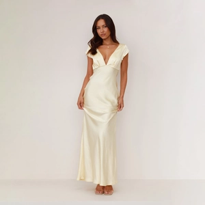 Detailed close-up of a slim fit satin dress featuring a deep V-neck and silky texture