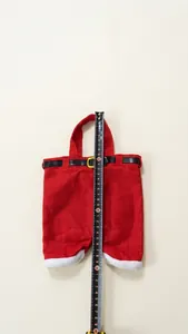 Detailed measurement showing 30cm height of red Santa pants candy bag with belt buckle