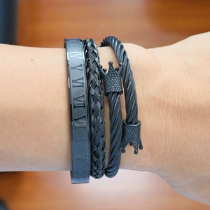 Men's black stainless steel bracelet set with crown, roman numerals, and braided details