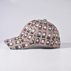 Unisex khaki baseball cap with hand-drawn cartoon faces print and curved brim style