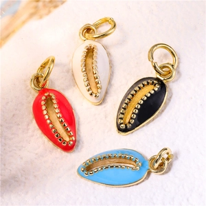 Detailed close-up of shell-shaped enamel pendants with gold beads for DIY jewelry making