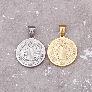 Saint Benedict coin pendants in gold and silver steel finish shown from above