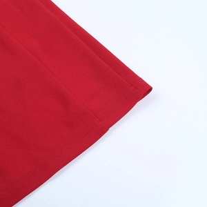 Detailed close-up of high-density double-needle stitching on red fabric edge