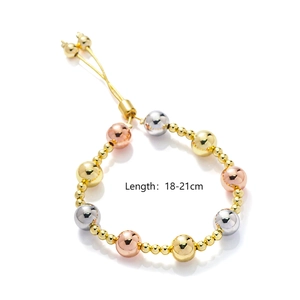 Detailed view of tricolor metal beaded bracelets in gold silver and rose gold finishes