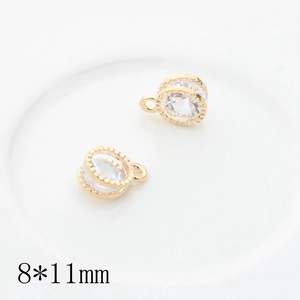 Macro shot of two golden zircon heart star charms for DIY jewelry 8x11mm size