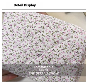 Close-up of diamond quilted texture and floral pattern on soft cotton makeup bag