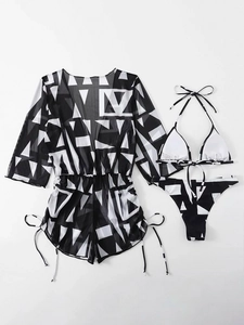 Detailed flat lay of three-piece swimwear set with black and white geometric print