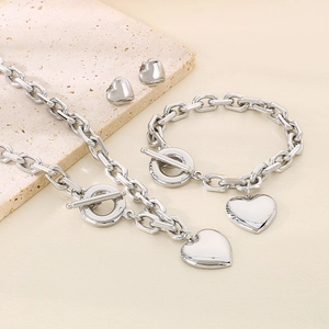 Polished silver stainless steel jewelry set with heart pendants and toggle clasp chain