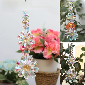 Detailed close-up showing crystal flowers and amber beads of the hanging suncatcher
