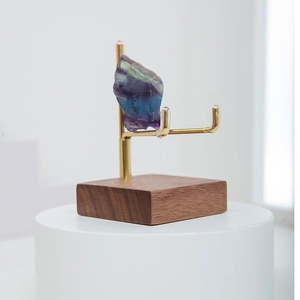 Mineral crystal specimen on brass metal arm with walnut wood display base stand