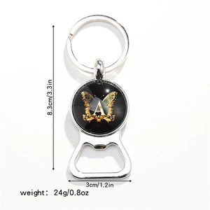 Close-up of a silver butterfly bottle opener keychain with letter A design and dimensions