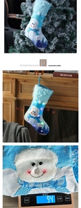 Blue LED Christmas stocking featuring snowman embroidery and white plush cuff detail