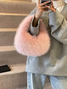 Chic pink faux fur handbag with a plush half-moon design for women winter fashion