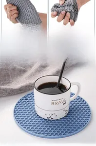 Detail of round honeycomb silicone mat showing flexibility and heat-resistant texture