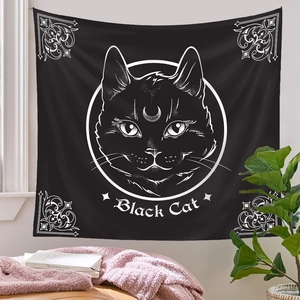 Detail of bohemian black cat tapestry with crescent moon moon and floral patterns