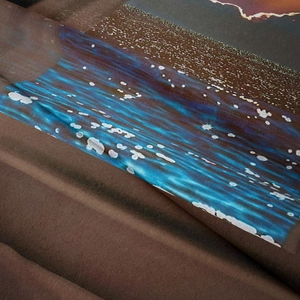 Detail shot of the digital landscape print and soft micro-fiber texture of the tapestry