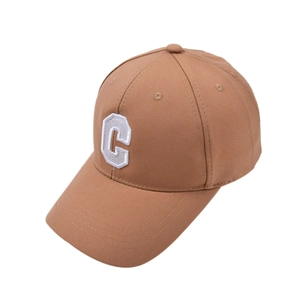 Detailed view of white letter C embroidery on high-quality brown cotton baseball cap