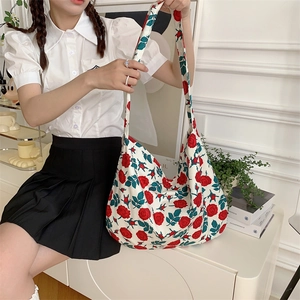 Spacious canvas shoulder bag with vintage red rose print and white fabric background