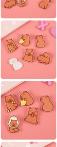 Detail of cute acrylic capybara pins for bags with a smooth finish and safety clasp
