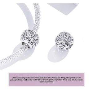 Macro shot of S925 sterling silver tree of life charm bead with cubic zirconia detail