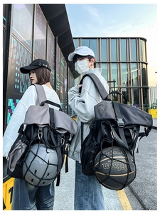 Outdoor sports backpack showing external mesh pocket for carrying a basketball or helmet