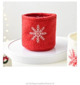 Detail of red wool felt Christmas storage basket with white snowflake embroidery