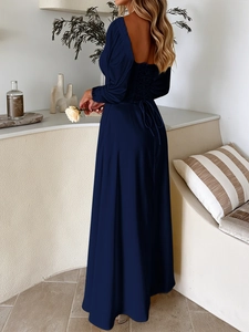 Detail of elegant navy blue evening dress showing the back lace-up design and fabric drape