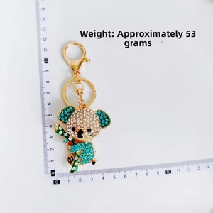 Detail of cute rhinestone koala keychain showing dimensions and weight about 53 grams