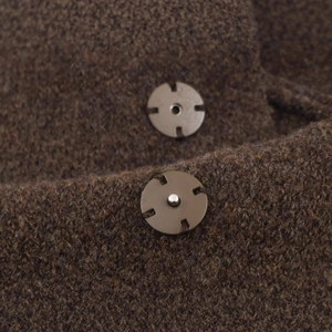 Brown knitted cardigan with vintage metal snap buttons featuring cross-shaped details