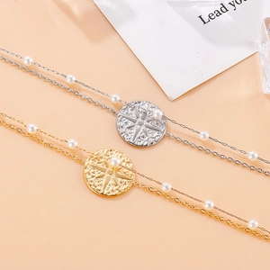 Double-layered stainless steel chain bracelet with starburst pendant and white pearls