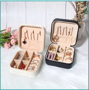 Detail view of portable PU jewelry box featuring necklace hooks and ring storage slots