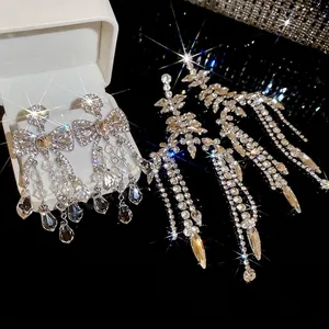 Elegant silver tassel earrings with sparkling rhinestones and crystal teardrop design