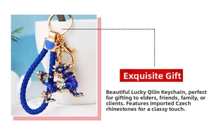 Macro detail of blue enamel kylin keychain with Czech rhinestones and woven lanyard